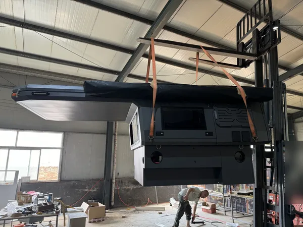 Camper body lifted for fitting